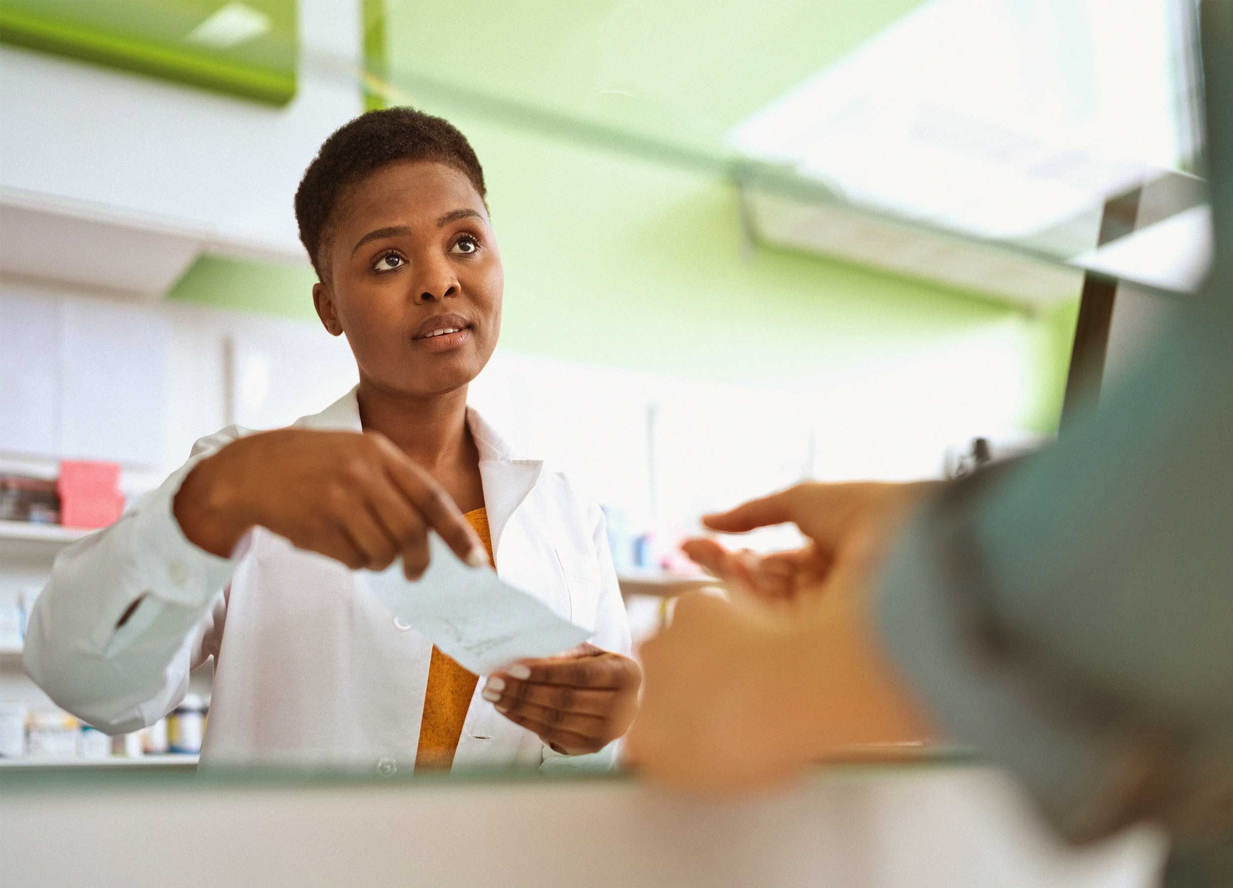 visual of pharmacist with patient 